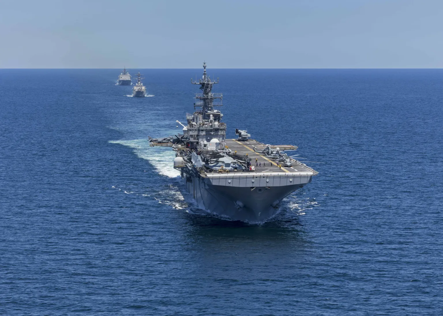 USS Spruance intercepting an Iranian-flagged cargo vessel in the Arabian Sea during blockade enforcement operations