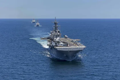 USS Spruance intercepting an Iranian-flagged cargo vessel in the Arabian Sea during blockade enforcement operations