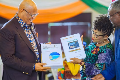 Governor Umo Eno receiving the Ibom Deep Seaport feasibility report in Uyo