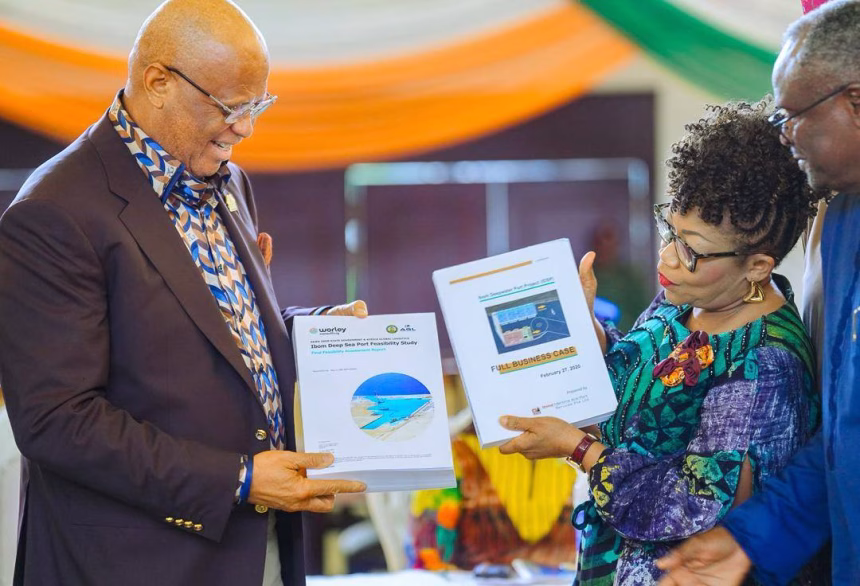 Governor Umo Eno receiving the Ibom Deep Seaport feasibility report in Uyo