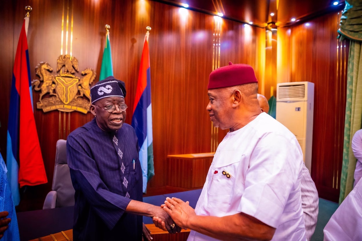 President Bola Tinubu shakes hands with Senator Orji Uzor Kalu during a meeting at the Presidential Villa in Abuja