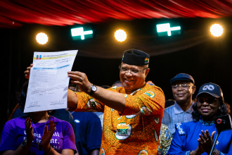Governor Umo Eno receives certificate of return after winning the Akwa Ibom APC governorship primary.
