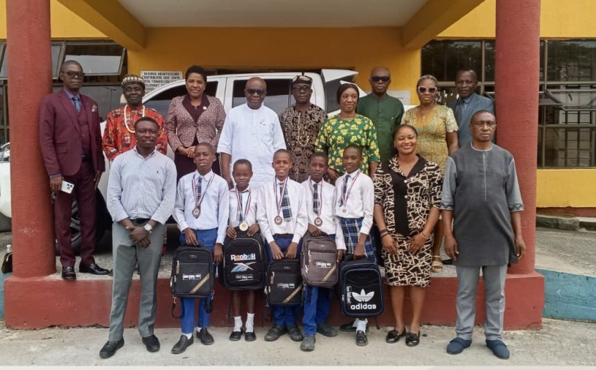 Akwa Ibom SUBEB Chairman Dr Anietie Etuk meeting members of the UBEC Smart School Obio Akpa School Based Management Committee
