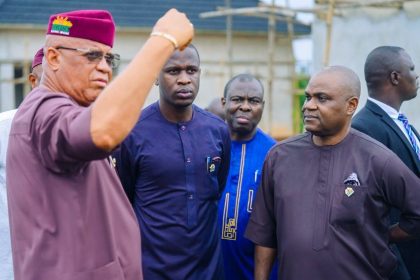 Akwa Ibom State Governor Pastor Umo Eno announcing a new flood and drainage master plan during an inspection of the Judiciary Staff Quarters project in Uyo.