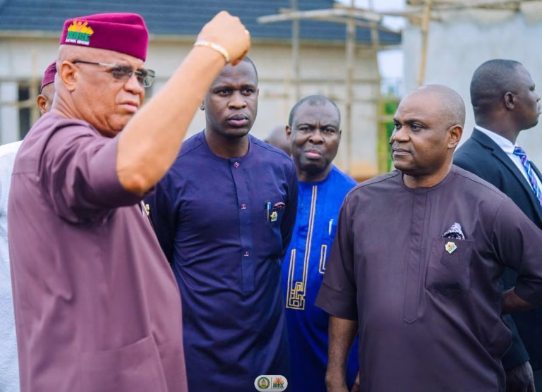 Akwa Ibom State Governor Pastor Umo Eno announcing a new flood and drainage master plan during an inspection of the Judiciary Staff Quarters project in Uyo.